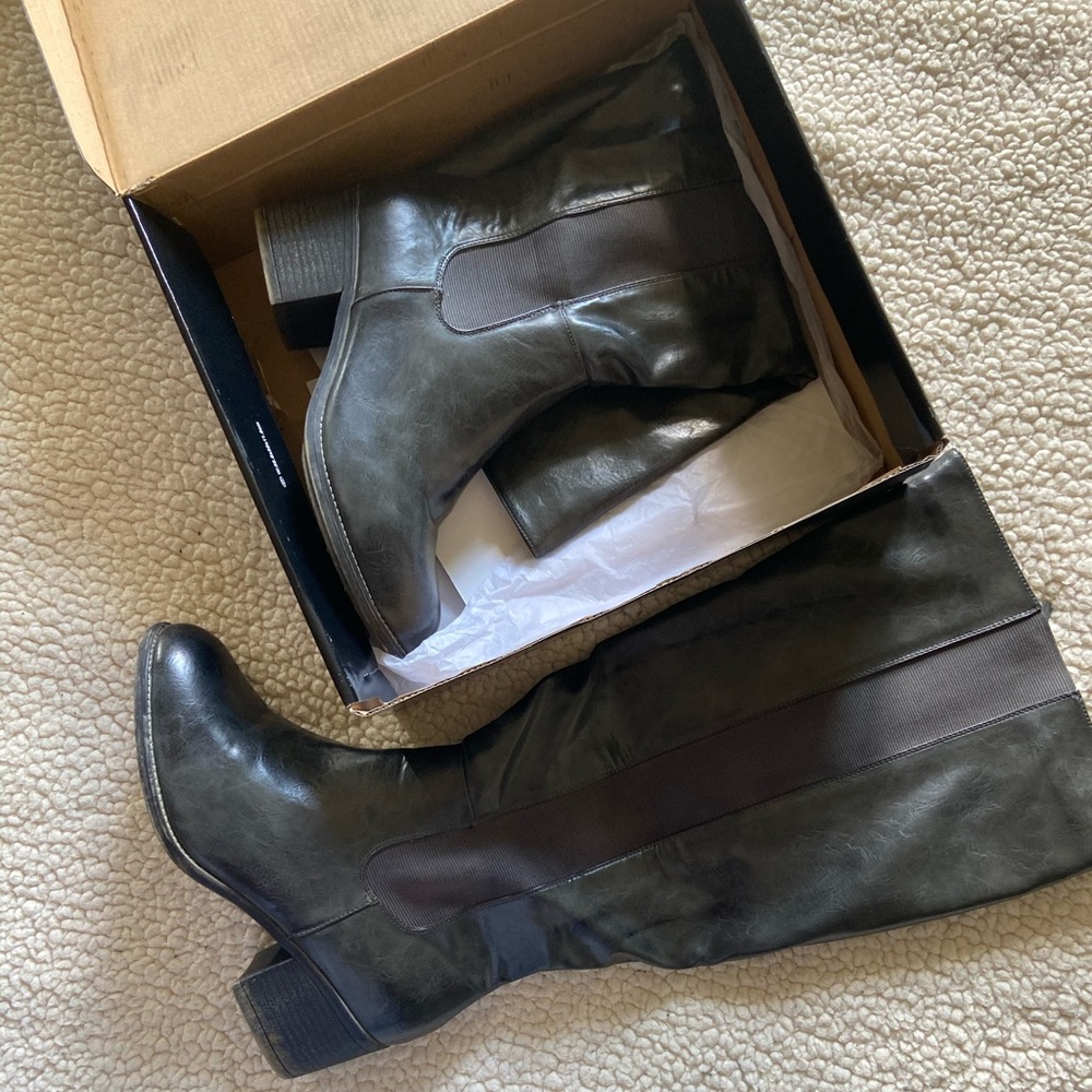 Gray knee high boots.